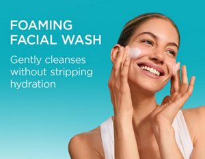 Young woman cleansing her skin with Curél Foaming Facial Wash against a teal background